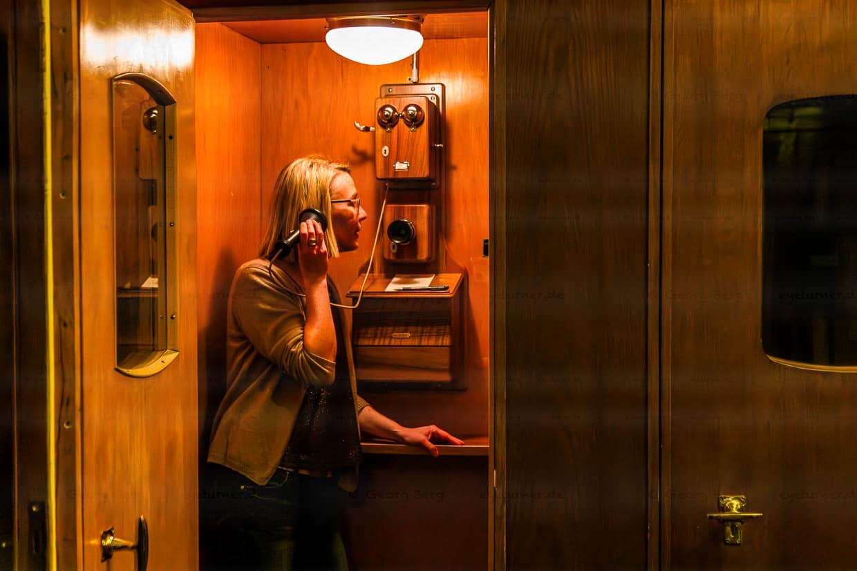 The old telephone booth in the Waldhaus is now a cell phone retreat for the benefit of all guests who want to use the lounges and many other places in the house to read, play, talk or think. Pleasant times when the telephone was located in its own booth and not in everyone's pocket / © Photo: Georg Berg